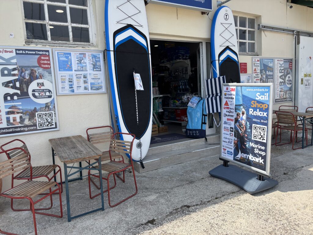 nautical shops on brac island: Exterior view of Embark Nautical marine shop in Milna harbour, Brač island.